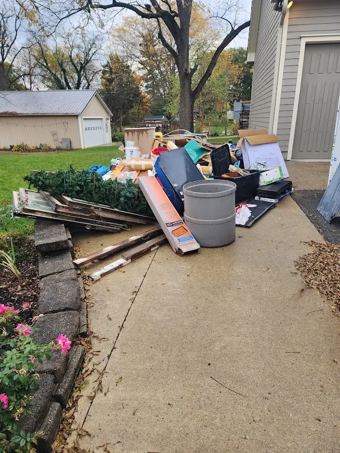 Dumpster being loaded with debris for Roofing Dumpster Rental in Willowick
